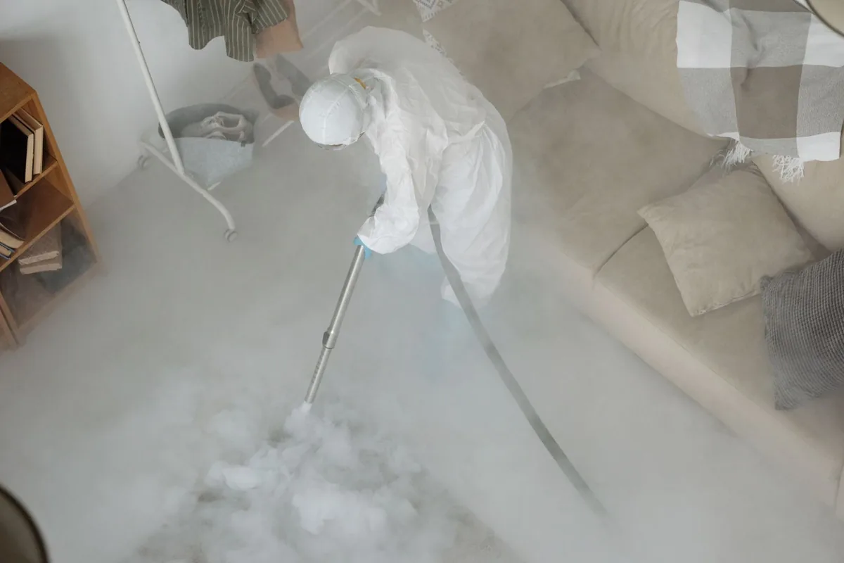 Biohazard cleanup technician in protective equipment, Gates, NY
